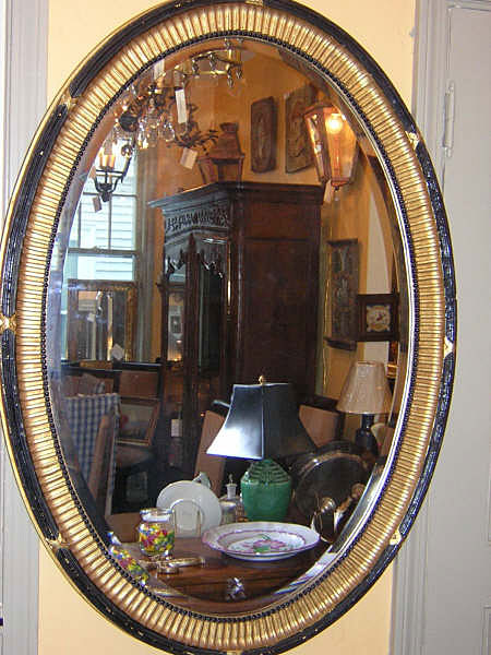 English Regency style oval wood frame mirror